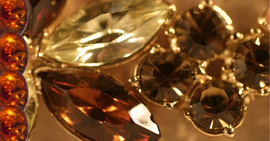 Close-up of faceted acrylic gemstones in warm tones